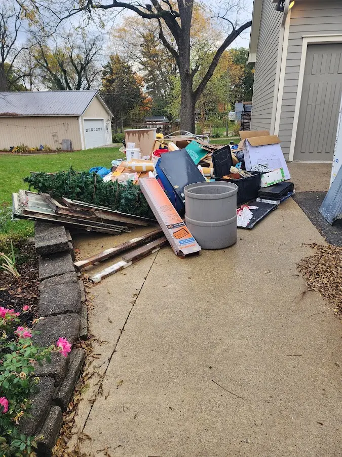 Dumpster being loaded with debris for 10 Yard Dumpster Rental in Grayslake